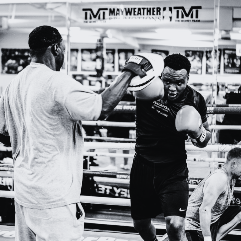 Jeff Mayweather leading a mitt-work session in the boxing gym