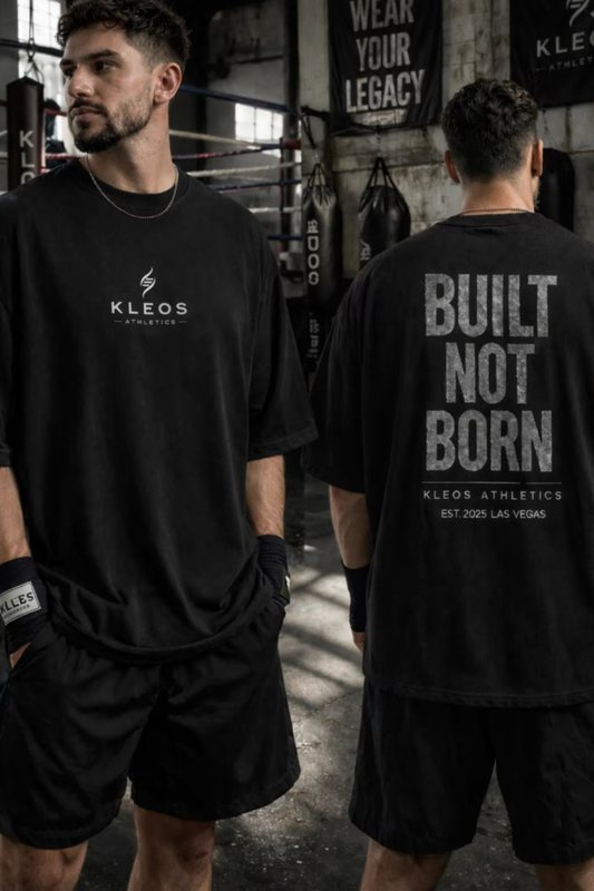 Front and back of the black KLEOS Built Not Born oversized tee